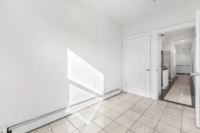 a view of a house with wooden fence