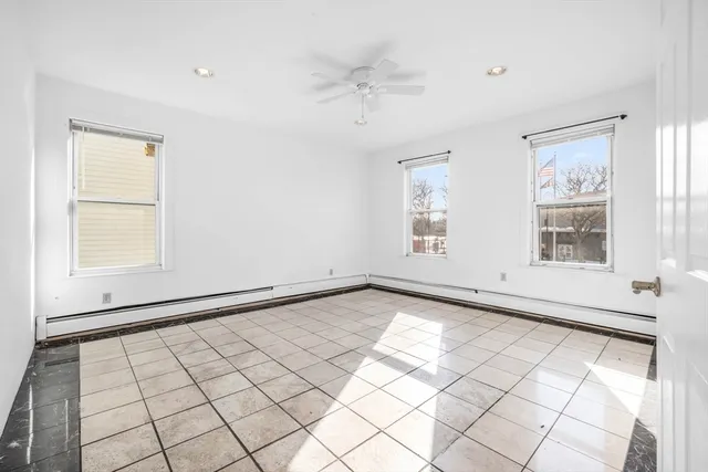 a bedroom with a bed and a table