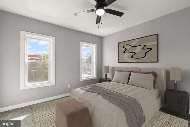 a bedroom with a large bed and a window