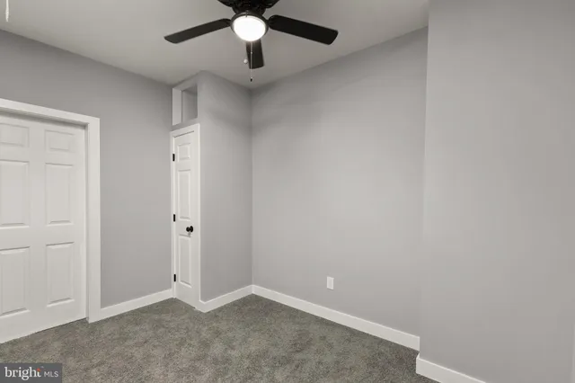 an empty room with fan