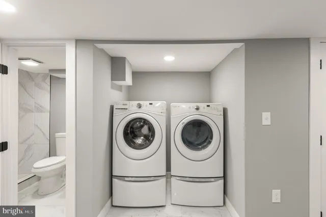 a utility room with dryer and washer