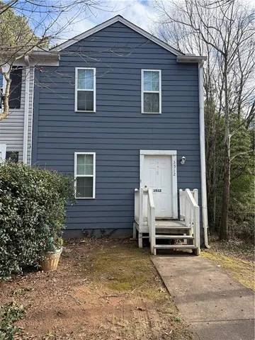 a front view of a house with stairs