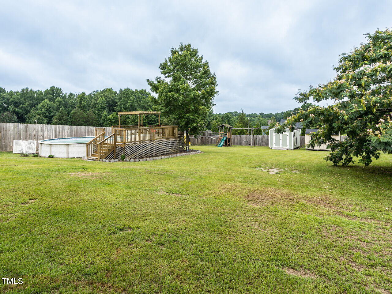 855 White Memorial Church Road Willow Spring, NC 27592 - Photo 31 of 34 029-1280x960-fenced-backyard-with-pool