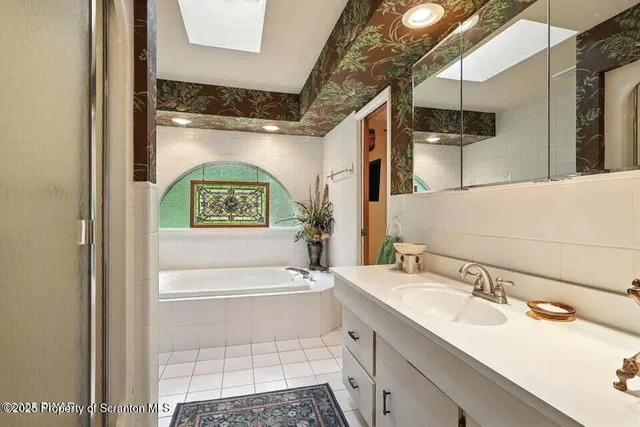 a bathroom with a sink and a shower