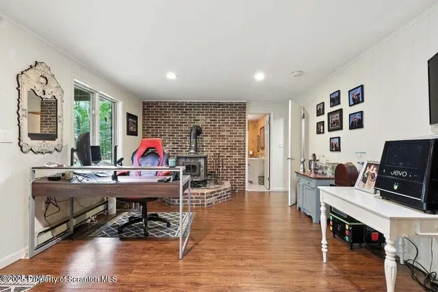 a view of a workspace with furniture and a living room
