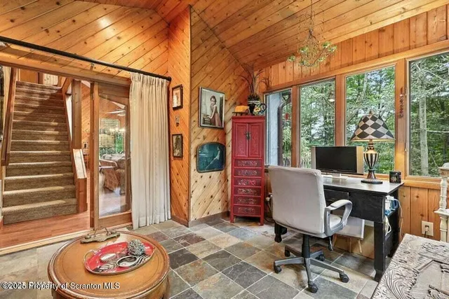 a work room with furniture and a window