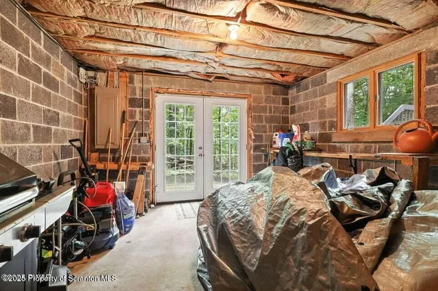 a bed room with a bed and a chair