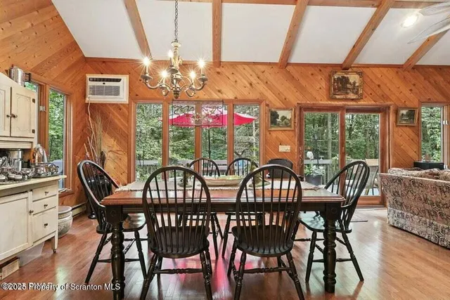 a view of a dining room with furniture window and outside view
