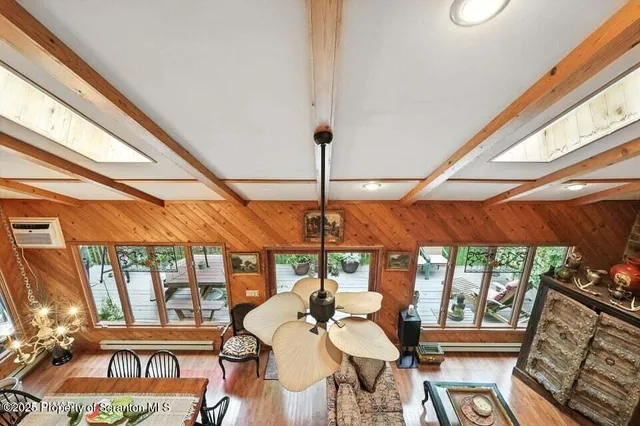 a dining room with furniture water view and balcony