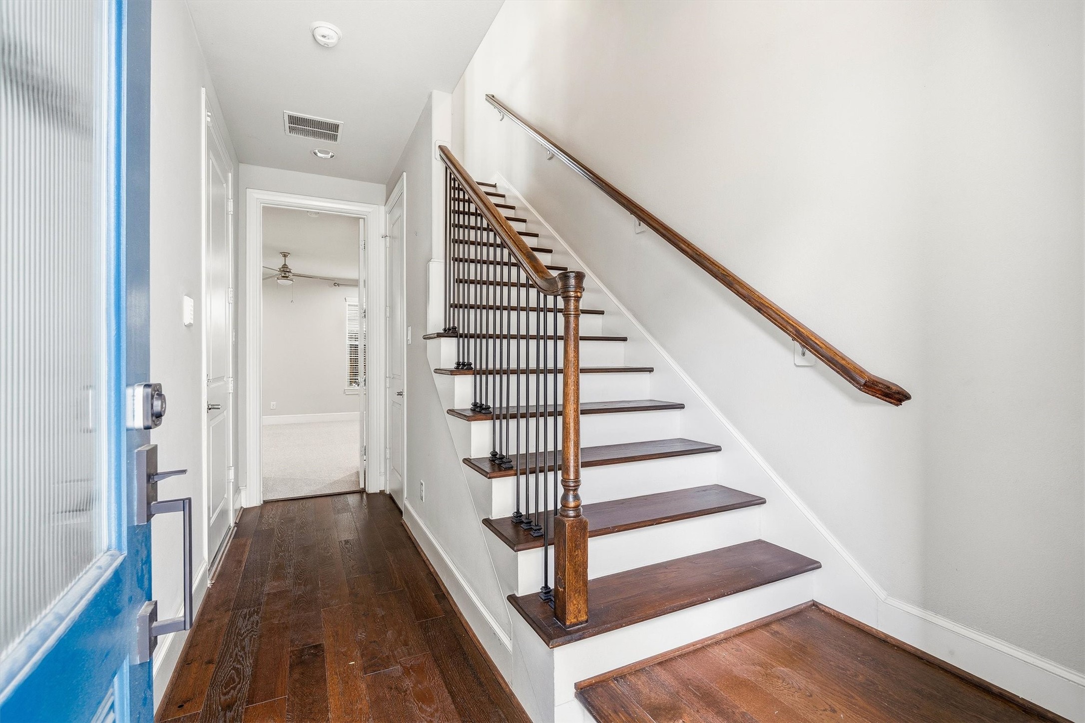 9614 Riddlewood Lane Houston, TX 77025 - Photo 3 of 23 a view of a hallway with wooden floor and entryway