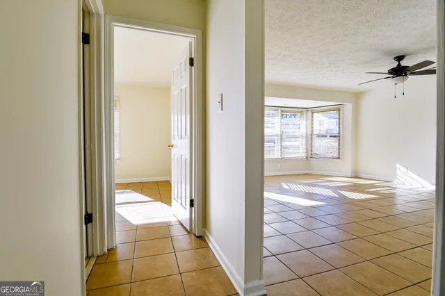 a view of a bathroom from a hallway