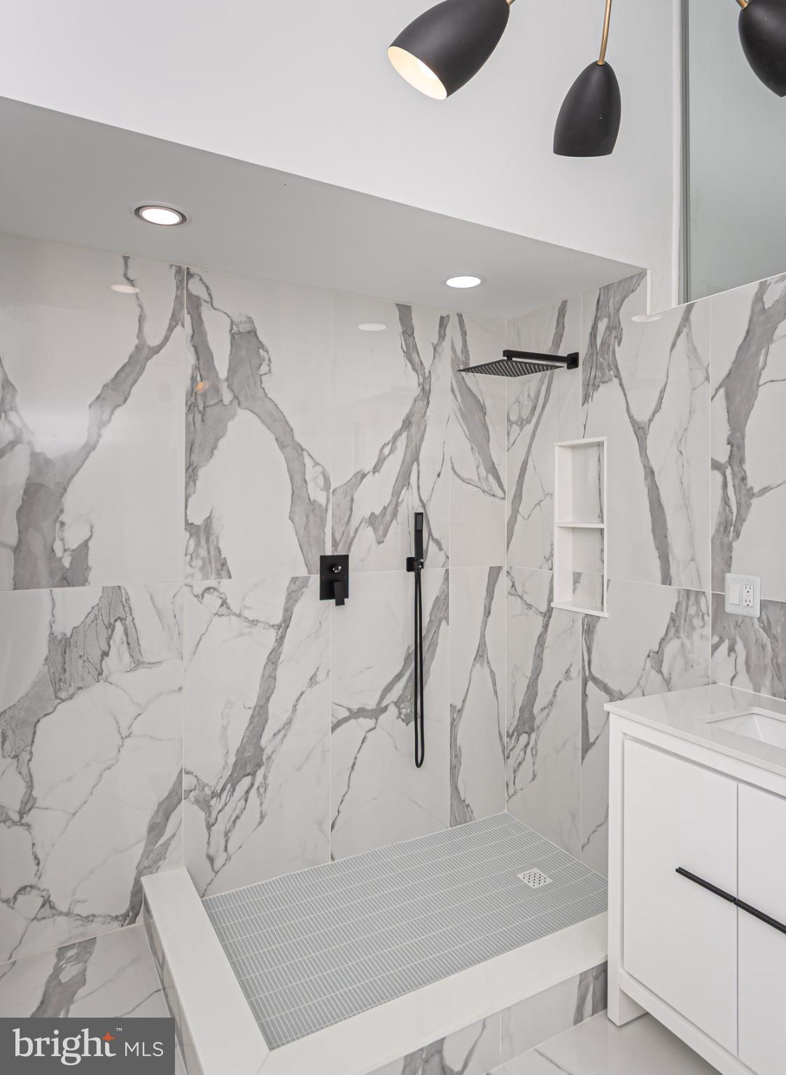 903 Ivy Hill Road Cockeysville, MD 21030 - Photo 46 of 100 Sleek marble shower with modern fixtures.