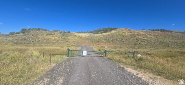 4000 Ant Flat Road, Unit 53 Huntsville, UT 84317 - Photo 4 of 11 View of street featuring a mountain view, a gate, and a rural view