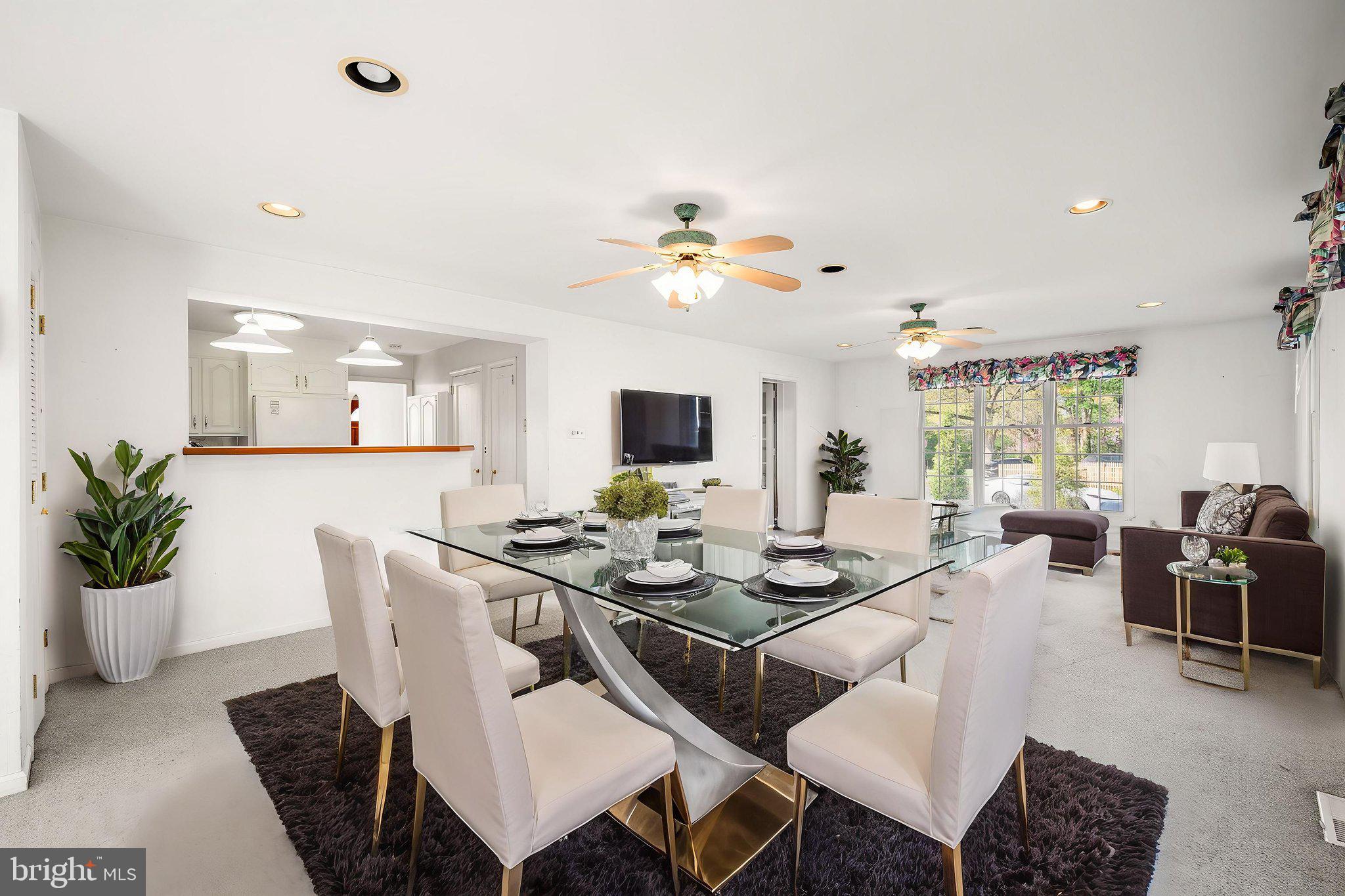 101 East Rose Valley Road Wallingford, PA 19086 - Photo 13 of 38 a view of a dining room with furniture and wooden floor
