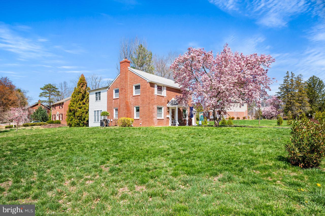 101 East Rose Valley Road Wallingford, PA 19086 - Photo 2 of 38 a view of a house with a big yard and large trees