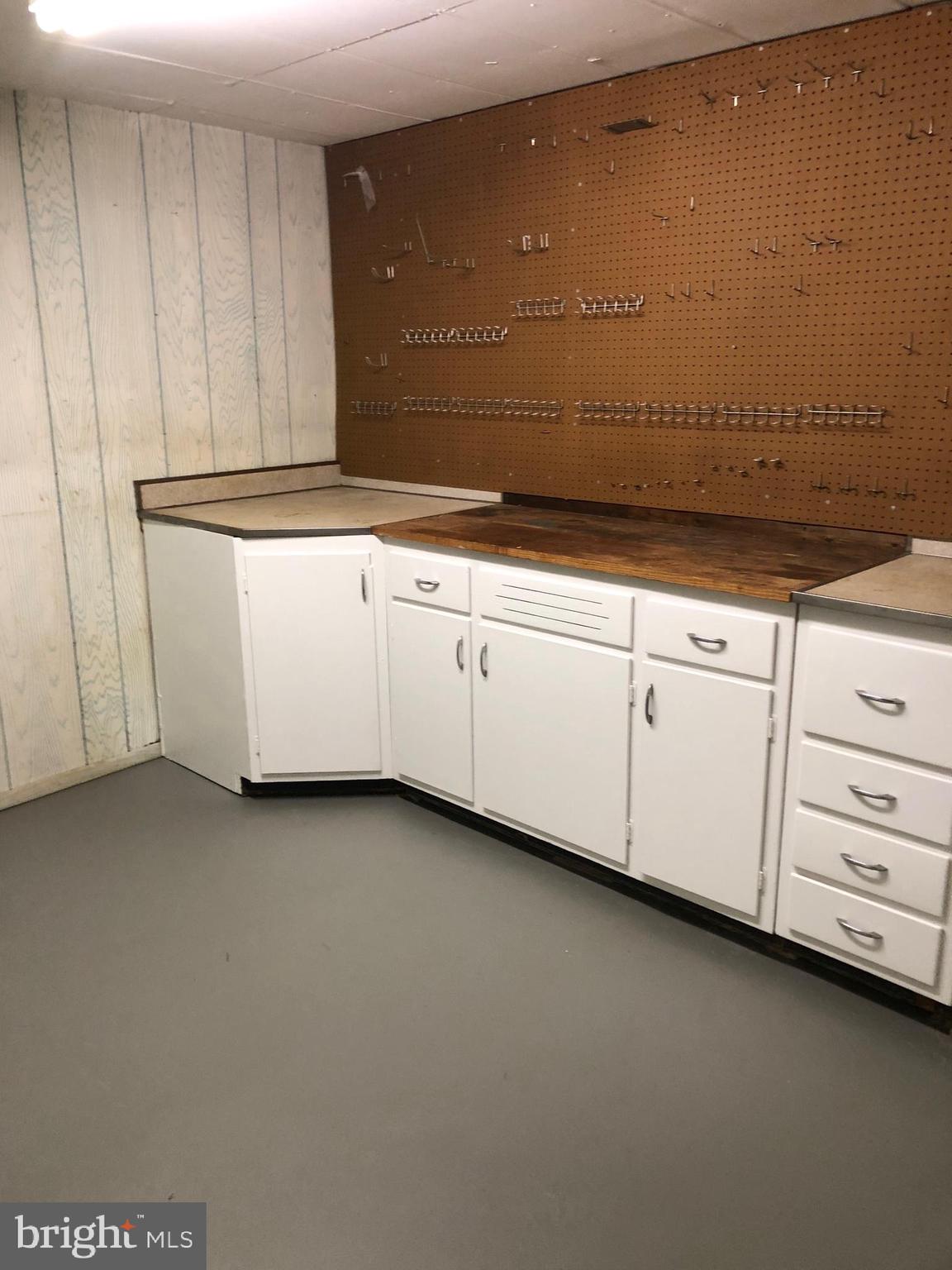 101 East Rose Valley Road Wallingford, PA 19086 - Photo 32 of 38 a view of a kitchen with white cabinets