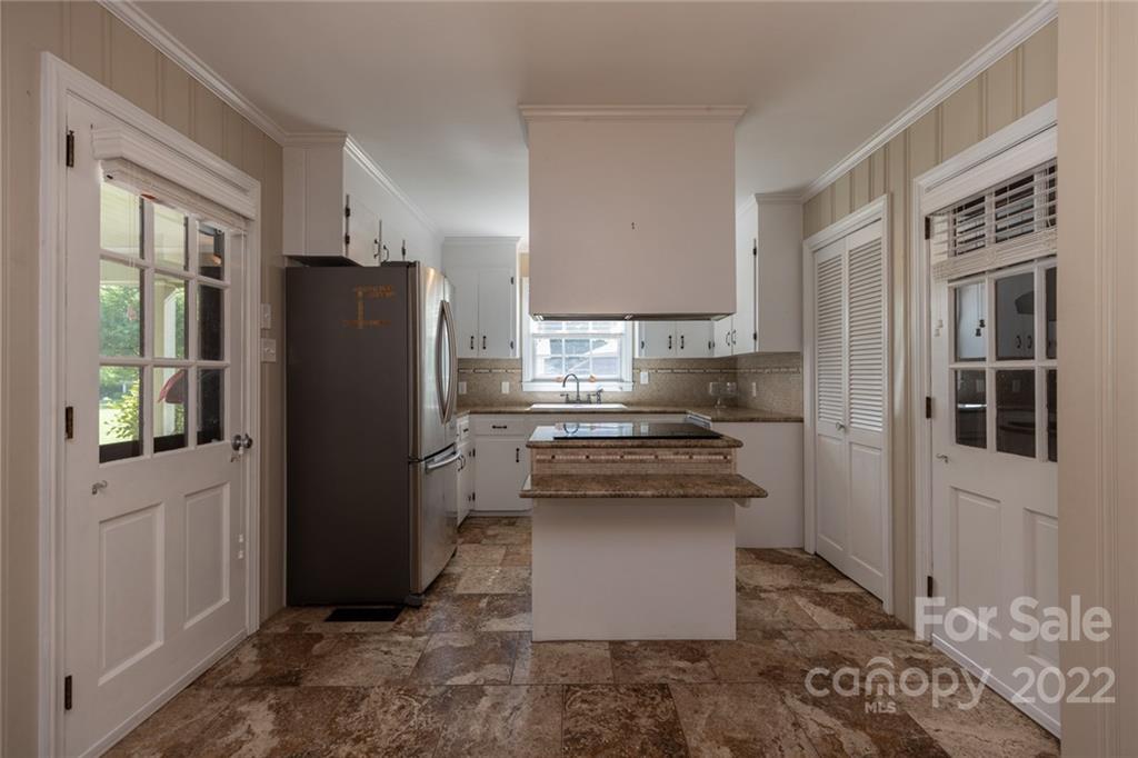 171 Orchard Road Statesville, NC 28677 - Photo 27 of 46 a kitchen with a refrigerator and a stove