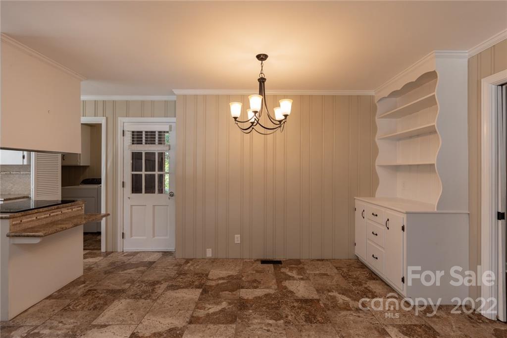 171 Orchard Road Statesville, NC 28677 - Photo 30 of 46 a view of a kitchen with dishwasher cabinet and a fireplace