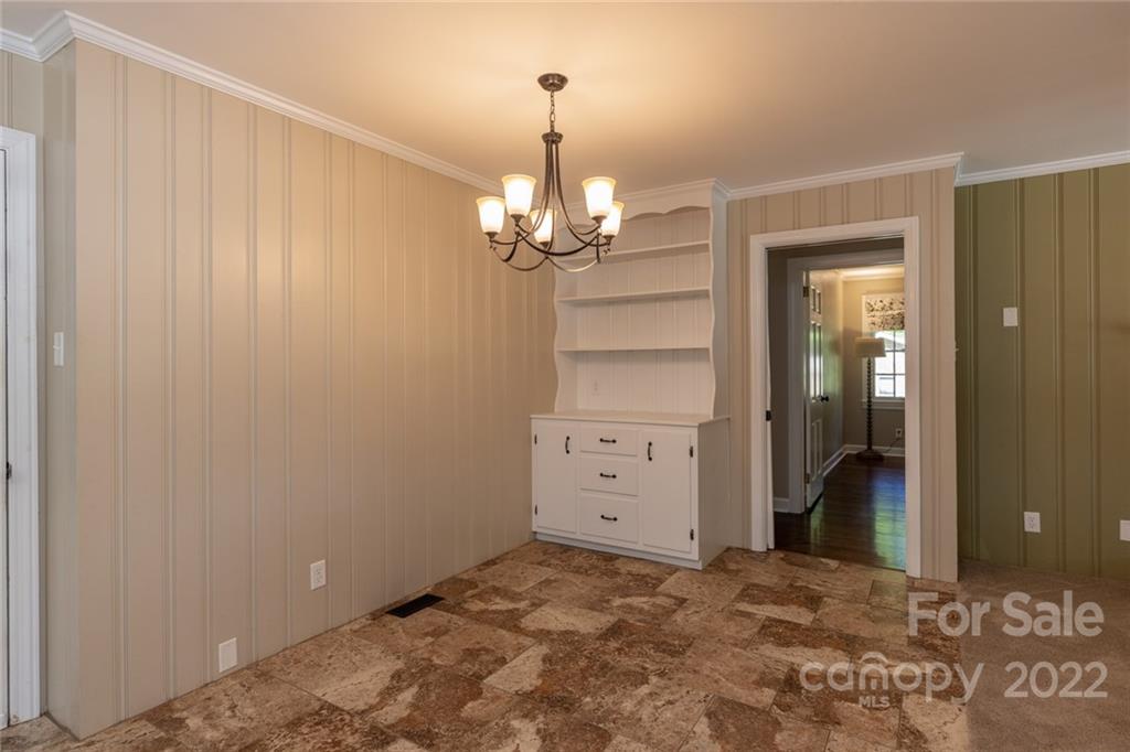171 Orchard Road Statesville, NC 28677 - Photo 31 of 46 a view of a bedroom with closet and chandelier fan