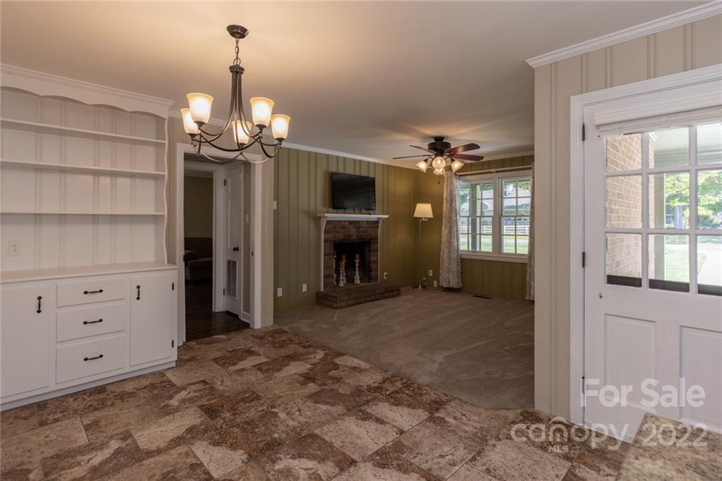 171 Orchard Road Statesville, NC 28677 - Photo 32 of 46 a view of a livingroom with a fireplace cabinet and windows