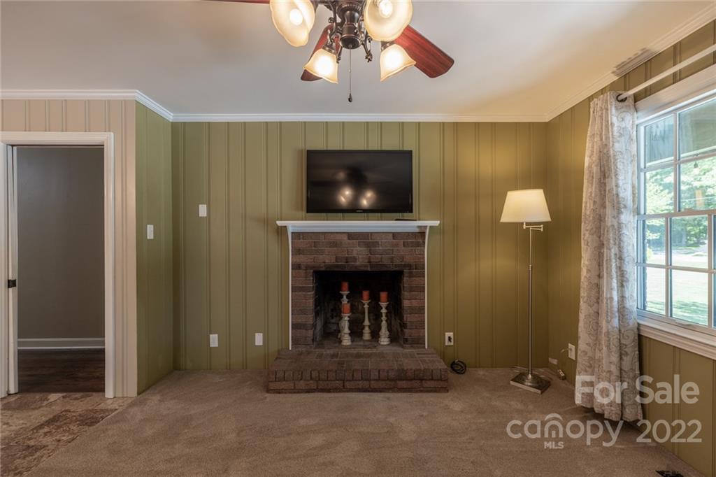 171 Orchard Road Statesville, NC 28677 - Photo 33 of 46 a living room with furniture and a fireplace
