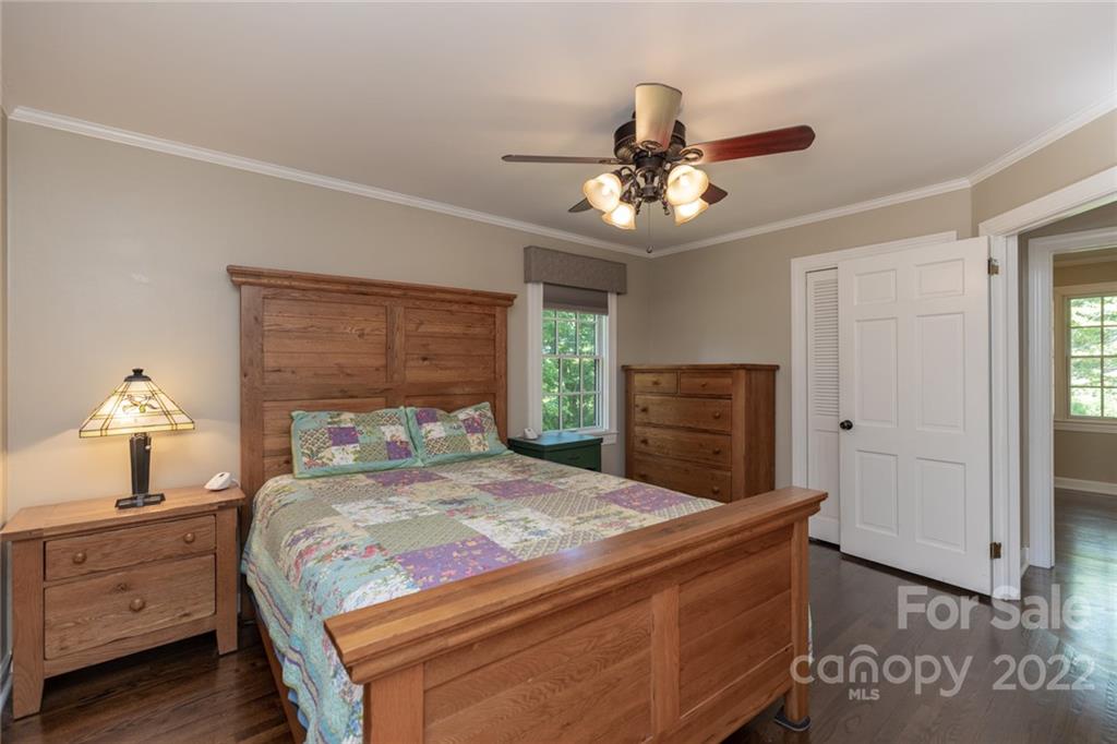 171 Orchard Road Statesville, NC 28677 - Photo 37 of 46 a bedroom with a bed and a chandelier