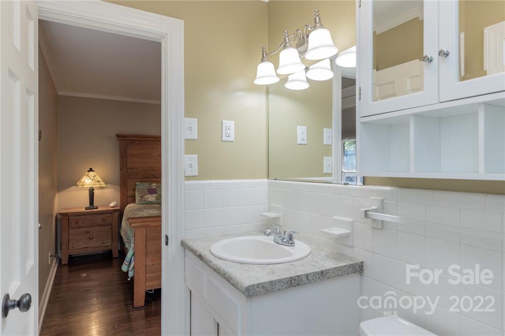 171 Orchard Road Statesville, NC 28677 - Photo 39 of 46 a bathroom with a sink vanity granite and a mirror