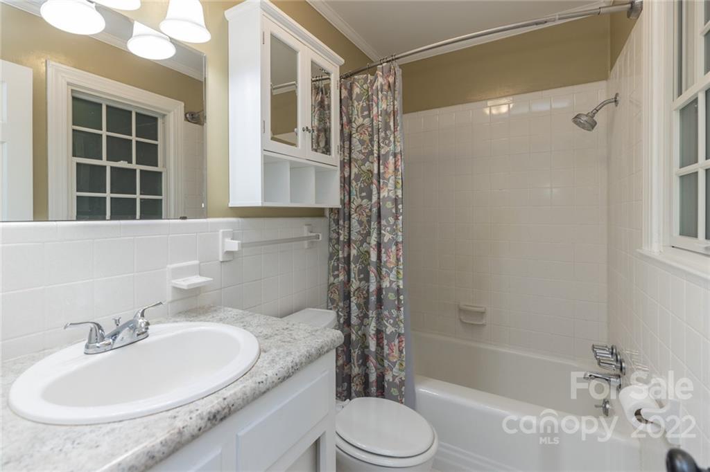 171 Orchard Road Statesville, NC 28677 - Photo 40 of 46 a bathroom with a granite countertop sink toilet and shower