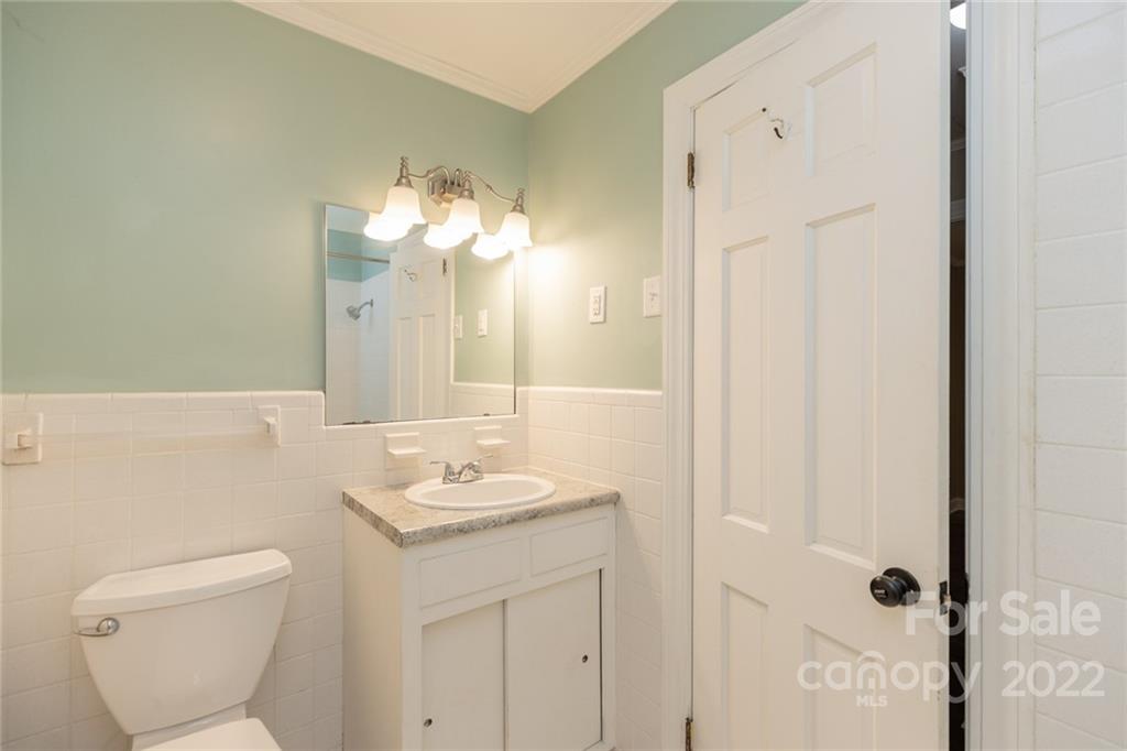 171 Orchard Road Statesville, NC 28677 - Photo 43 of 46 a bathroom with a sink a toilet and a mirror