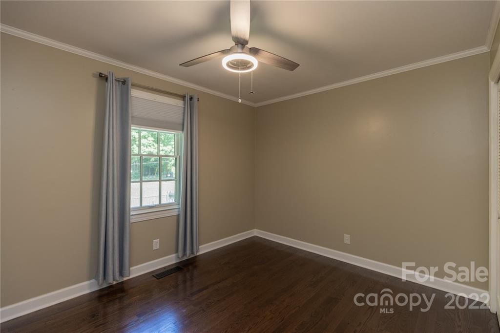 171 Orchard Road Statesville, NC 28677 - Photo 46 of 46 an empty room with wooden floor and windows
