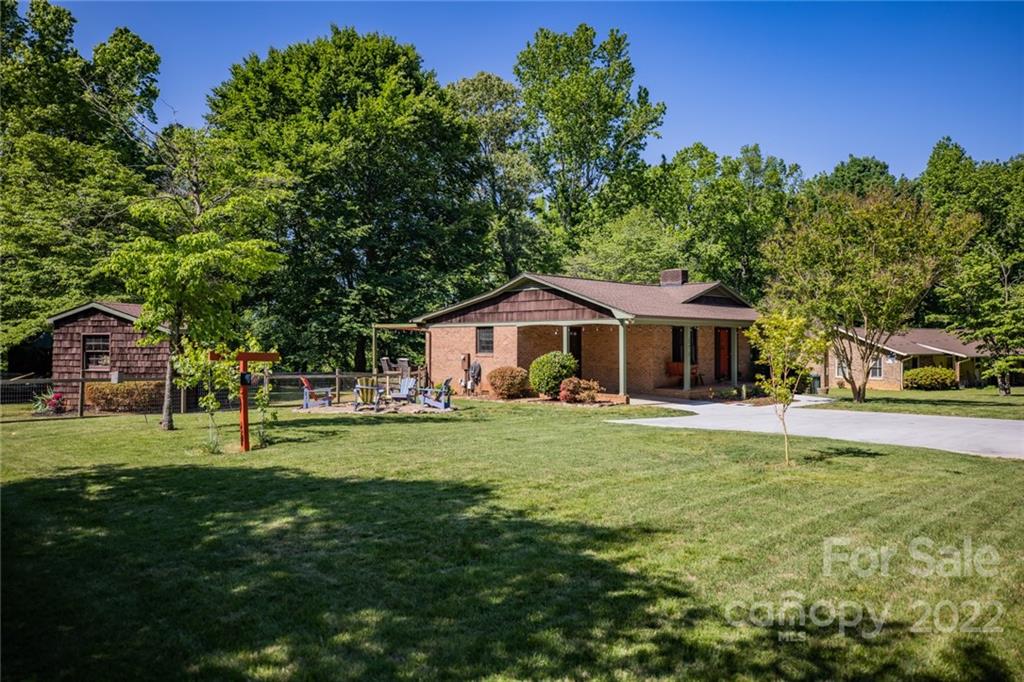 171 Orchard Road Statesville, NC 28677 - Photo 6 of 46 a front view of a house with a yard