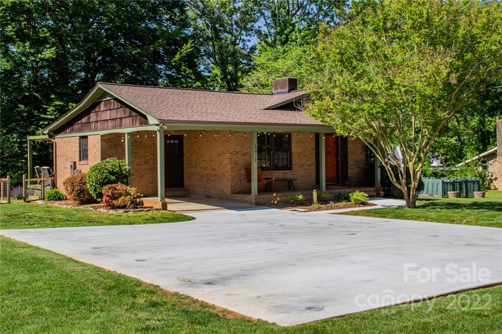 171 Orchard Road Statesville, NC 28677 - Photo 10 of 46 a front view of a house with a yard and garage