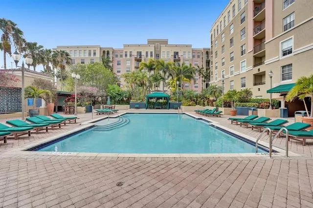 a view of a swimming pool with a lounge chairs