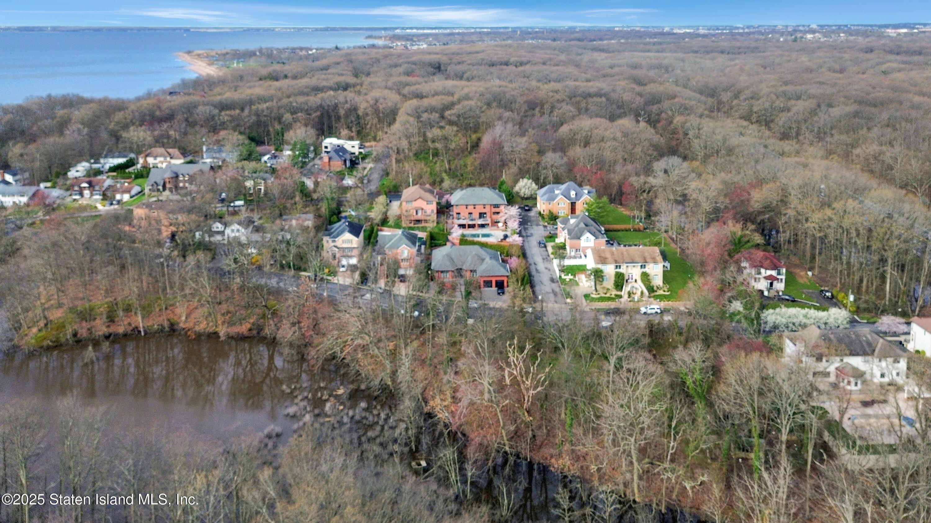 381 Arbutus Avenue Staten Island, NY 10312 - Photo 2 of 5 a view of a town with mountains in the background