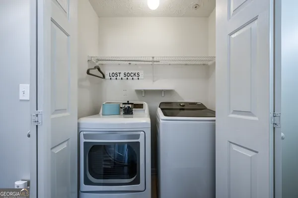 a view of washer and dryer in a utility room