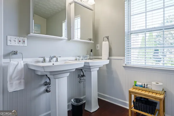 a bathroom with a sink and a window