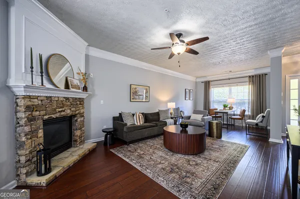 a living room with furniture and a fireplace