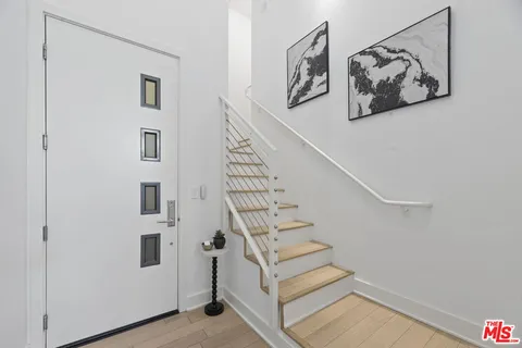 a view of entryway with stairs and furniture