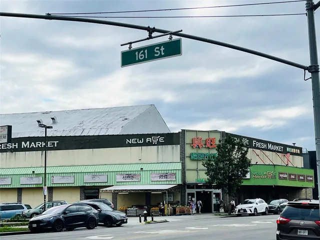 a view of a cars parked on the side of a street