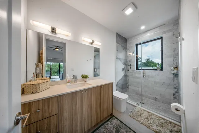 a bed room with a bed and a large window