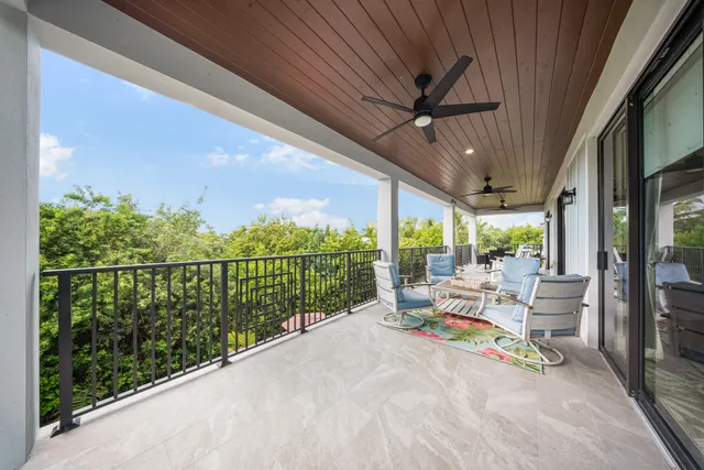 a bathroom with a double vanity sink toilet and shower