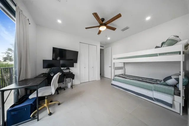 a view of a porch with furniture and garden