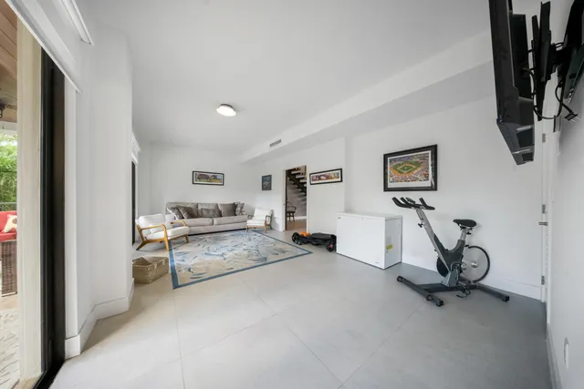 a view of a livingroom with furniture and a flat screen tv