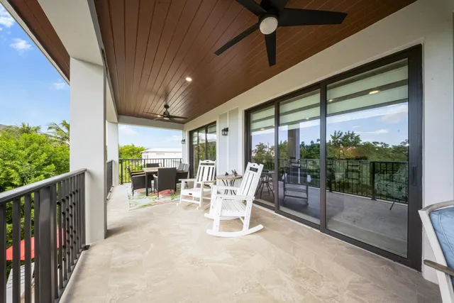 a dining room with furniture water view and garden view