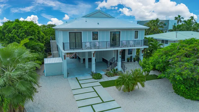 a view of house with garden and patio