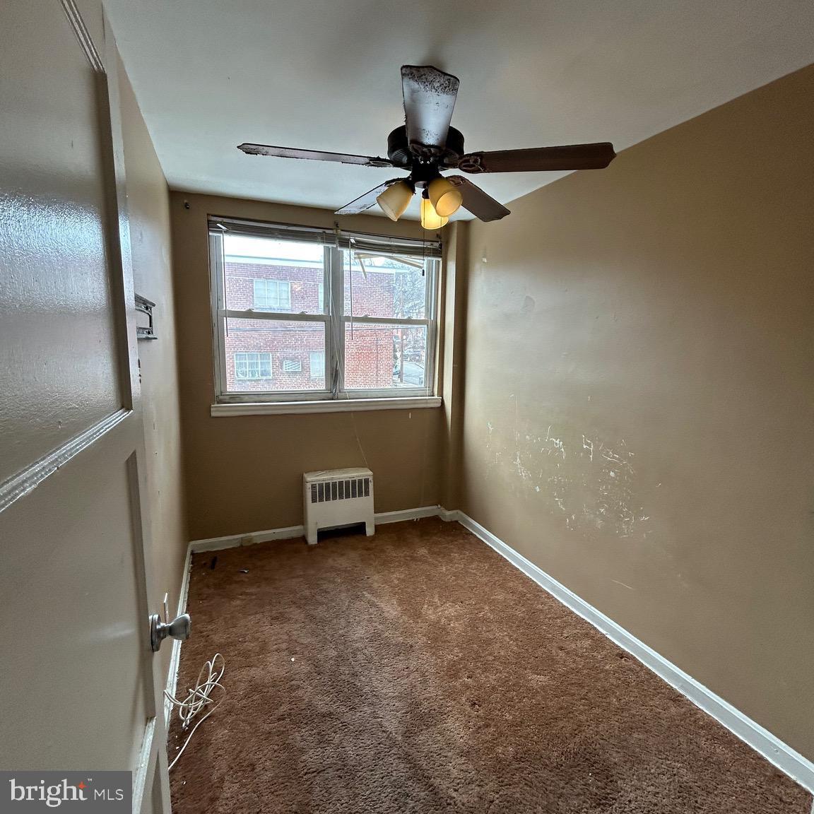 6426 North Capitol Street Northwest Washington, DC 20012 - Photo 11 of 18 an empty room with windows and fan