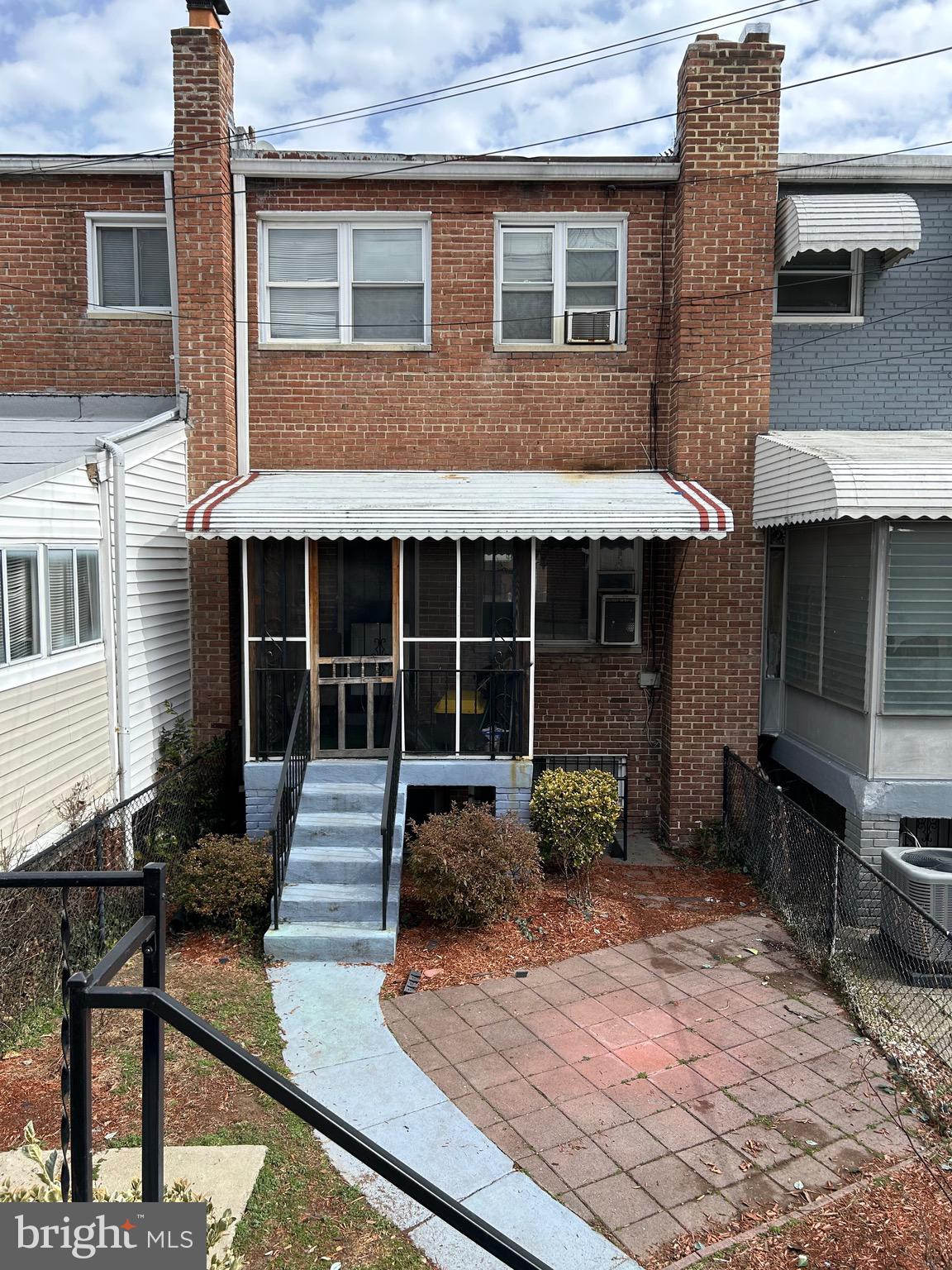 6426 North Capitol Street Northwest Washington, DC 20012 - Photo 17 of 18 a front view of a house with garden
