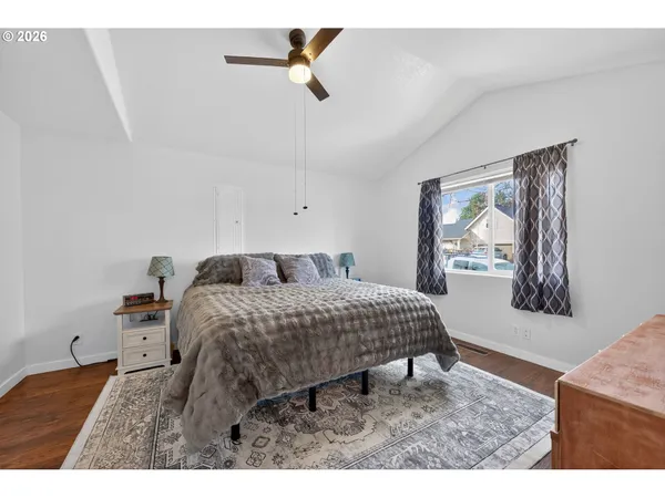 a living room with a bed furniture and a window