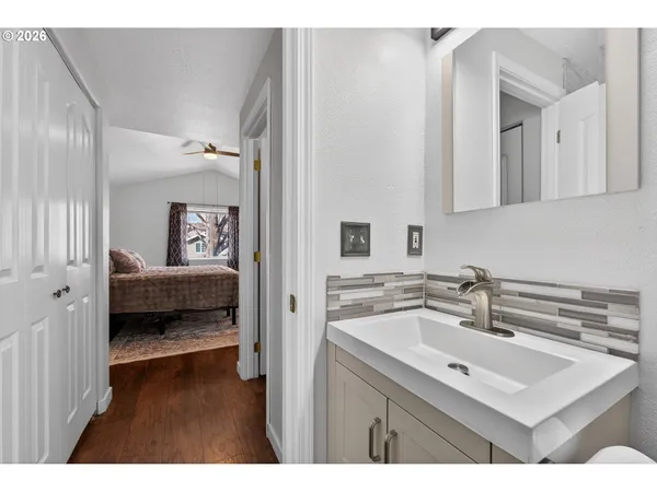 a bathroom with a sink and a mirror
