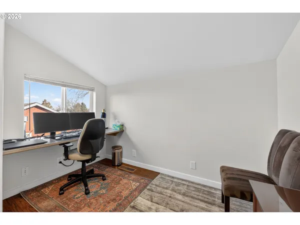 a workspace with furniture and a window